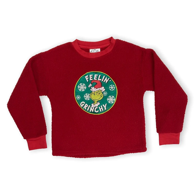 The Grinch Girls cropped popover. Bring your festive side wherever you go. This girls cropped sherpa top with long sleeves and crew neck is great for a comfy casual look and