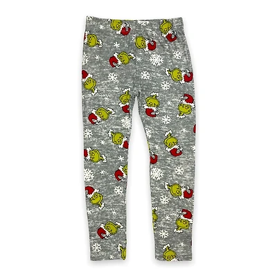 The Grinch Legging imprimé fille. Ces leggings longs pour filles ont une ceinture élastique et peuvent être portés avec n'importe quel haut et