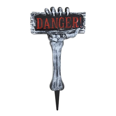 Piquet de jardin en plastique représentant une main de squelette pour Halloween, décorations d'extérieur, par Façon de célébrer <ul><li>Façon de célébrer Halloween sur le piquet de danger de la main du squelette</li><li>Décor extérieur sur le piquet de la cour d'Halloween</li><li>Le design présente une main de squelette tenant une pancarte indiquant « danger ! »</ li></ul>