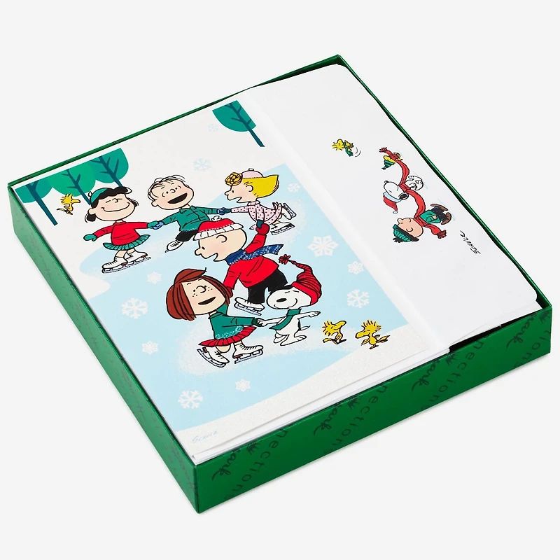 Boîte de 24 cartes de Noël Connections de Hallmark (La bande Peanuts fait du patin à glace)