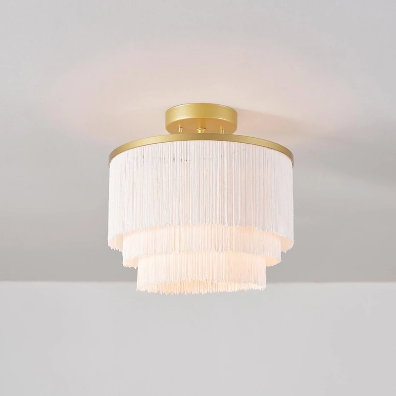 Plafonnier affleurant à 1 ampoule Janis de Novogratz x Globe, or mat, abat-jour en tissu frangé blanc