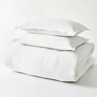 Better Homes & Gardens Ensemble de housse de couette froissée en gaze blanche arctique, 3 pièces, Adulte Double/Queen Attaches intérieures aux coins et sur les côtés. Fermeture à boutons dissimulés. Fermeture portefeuille sur les taies d’oreiller.