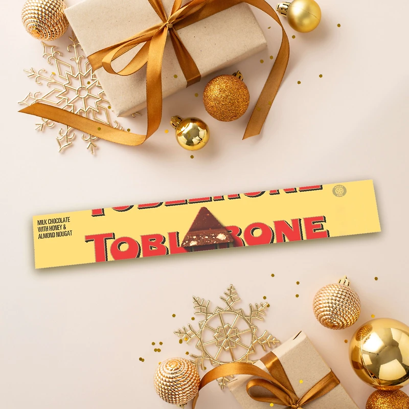 Tablette de chocolat au lait TOBLERONE avec nougat au miel et aux amandes 100 g