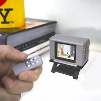 Tiny TV Classics - Family Guy Edition- Newest Collectible from Basic Fun - Watch top Family Guy scenes on a real-working Tiny TV (with working remote)!