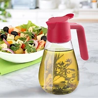 Starfrit Carafe Anti-Goutte, 600 ml, Verseur Étanche avec Bec Anti-Goutte et Joint Silicone, pour Sirop d’Érable, Crème, Huile, Vinaigre, Vinaigrette, Base Stable, Va au Lave-Vaisselle Cette carafe Starfrit de 600 ml est parfaite pour le sirop, la crème, l’huile ou le vinaigre. Bec anti-goutte, joint étanche, base stable et onglet facile à ouvrir. Contient une boîte complète de 540 ml de sirop. Va au lave-vaisselle.