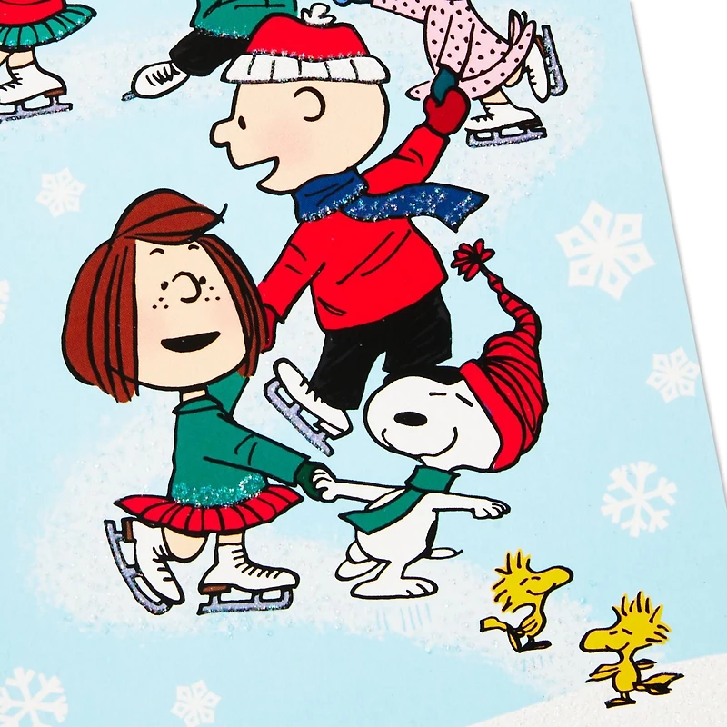 Boîte de 24 cartes de Noël Connections de Hallmark (La bande Peanuts fait du patin à glace)