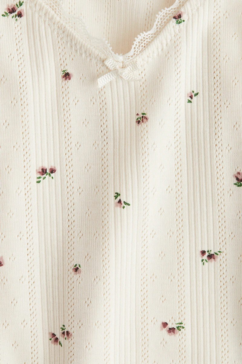 Haut à bretelles fines en pointelle