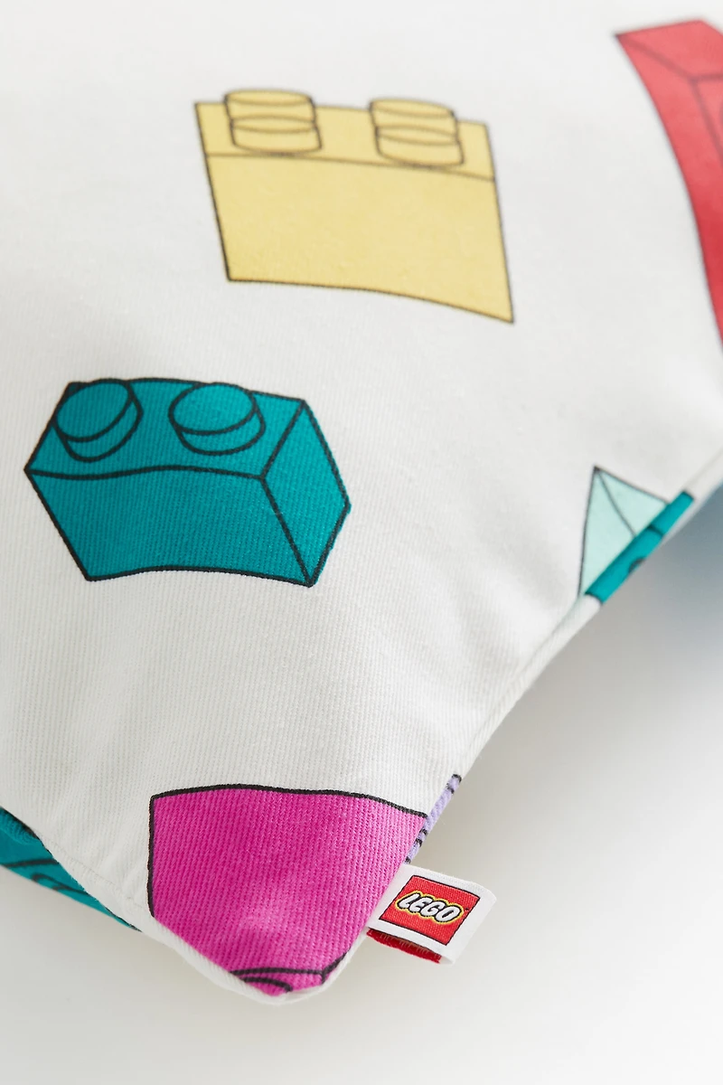 Housse de coussin à motif