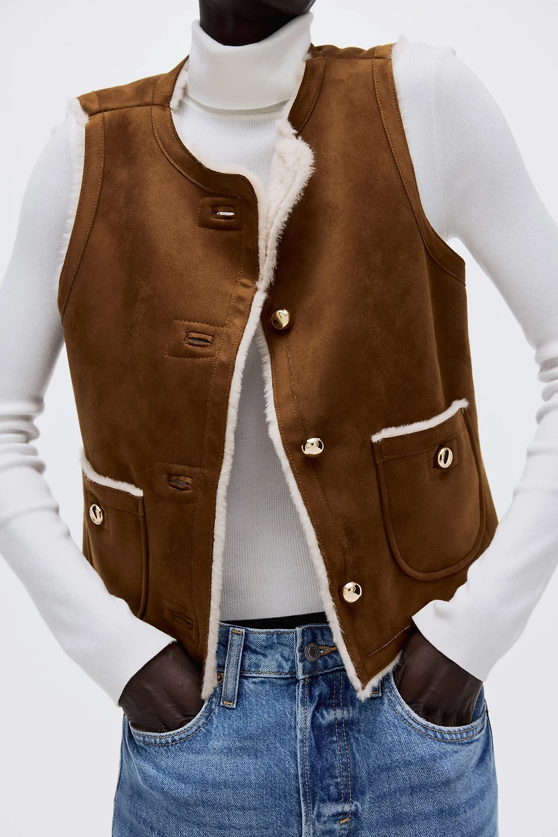 Veste sans manches doublée de tissu peluche