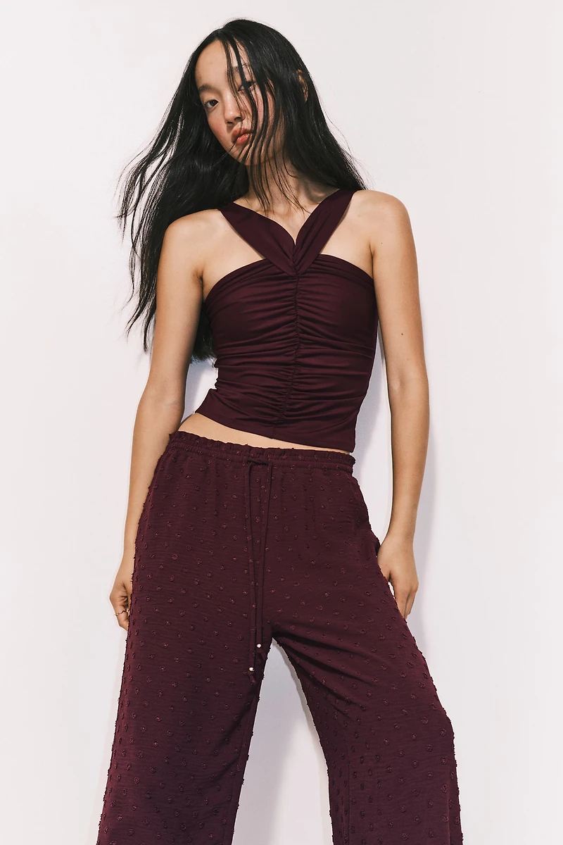 Pantalon en plumetis avec cordon de serrage