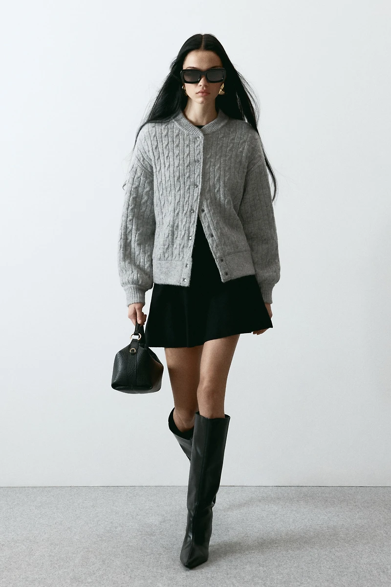 Blouson aviateur en tricot torsadé