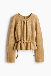 Haut péplum en tricot pointelle