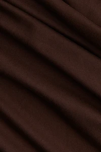Robe moulante à effet drapé