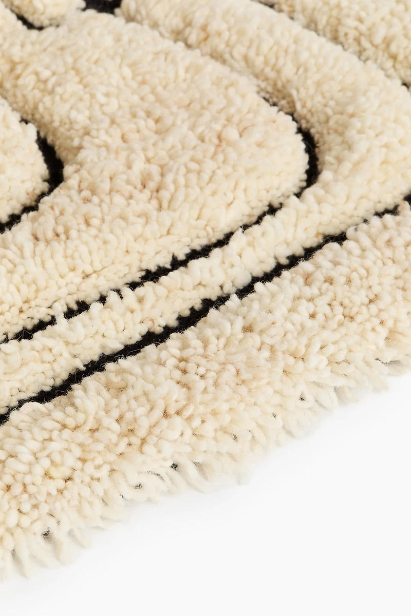 Tapis à franges en laine mélangée