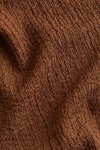 Pantalon évasé à effet froissé