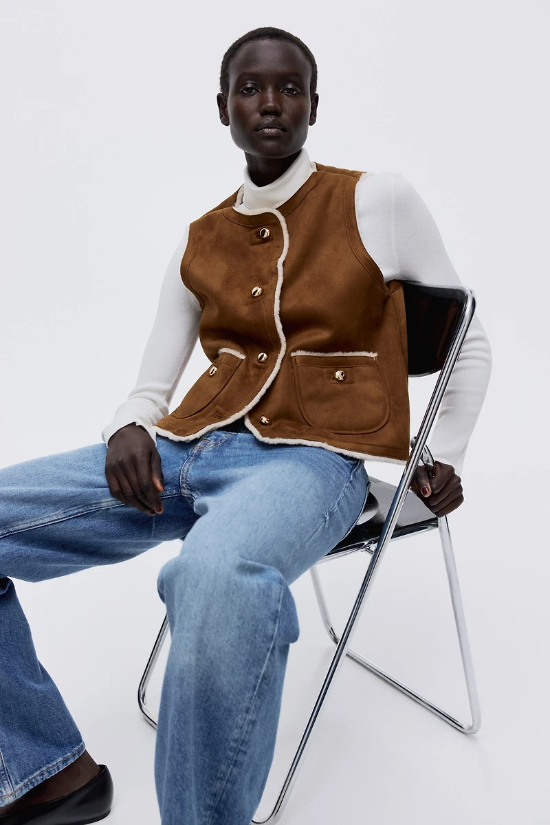 Veste sans manches doublée de tissu peluche