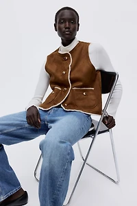 Veste sans manches doublée de tissu peluche