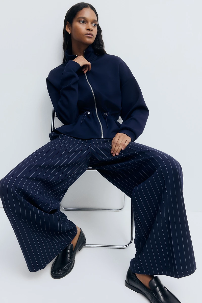 Chandail péplum à fermeture éclair