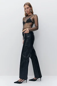 Pantalon en tissu enduit