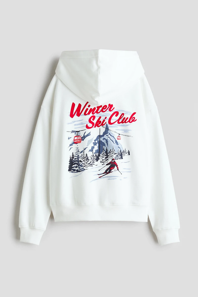 Chandail à capuche ample avec motif