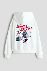 Chandail à capuche ample avec motif