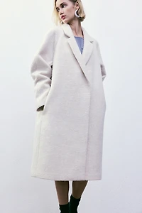 Manteau à fermeture croisée