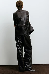 Pantalon en tissu enduit