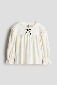 Blouse à bords picots