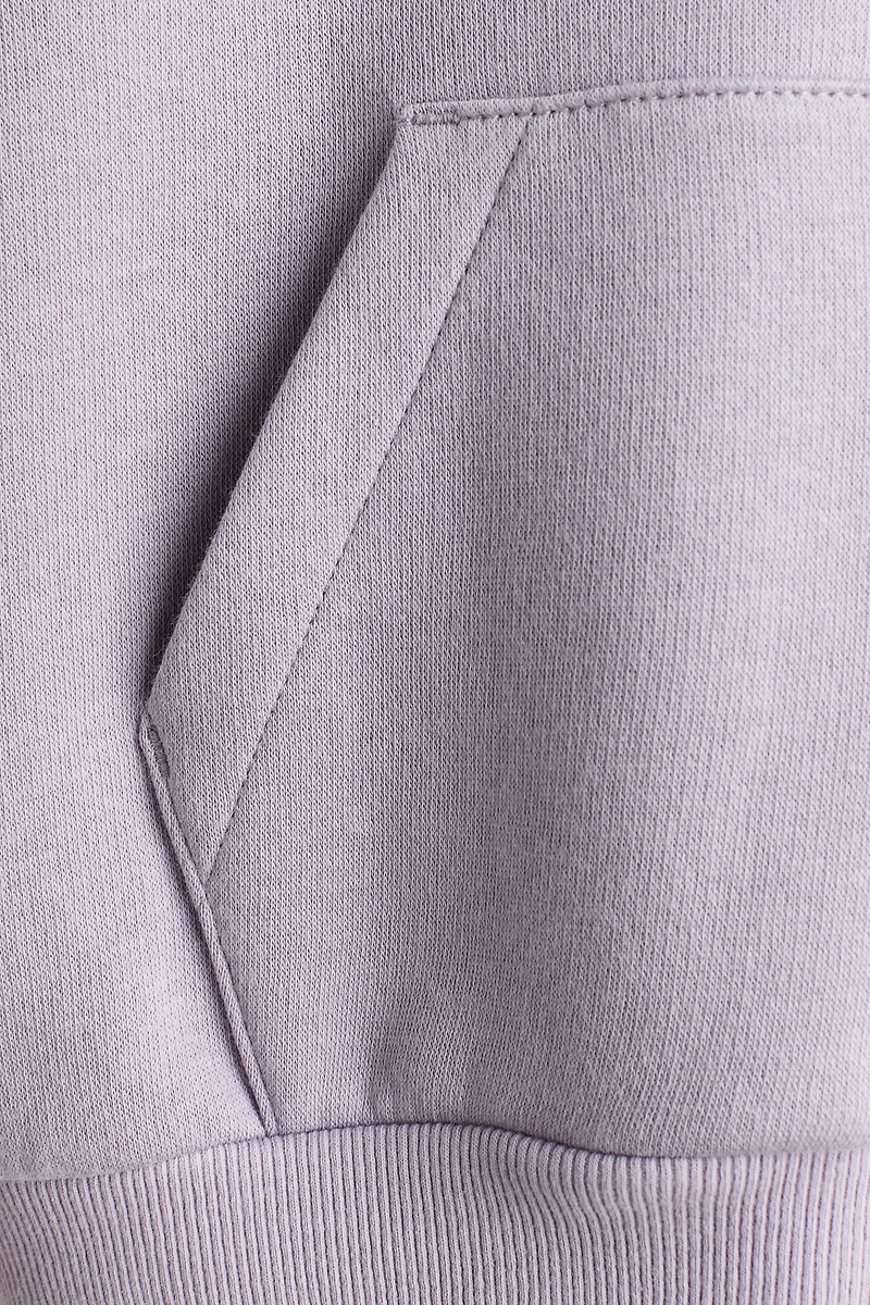 Veste grande taille à capuchon et fermeture éclair