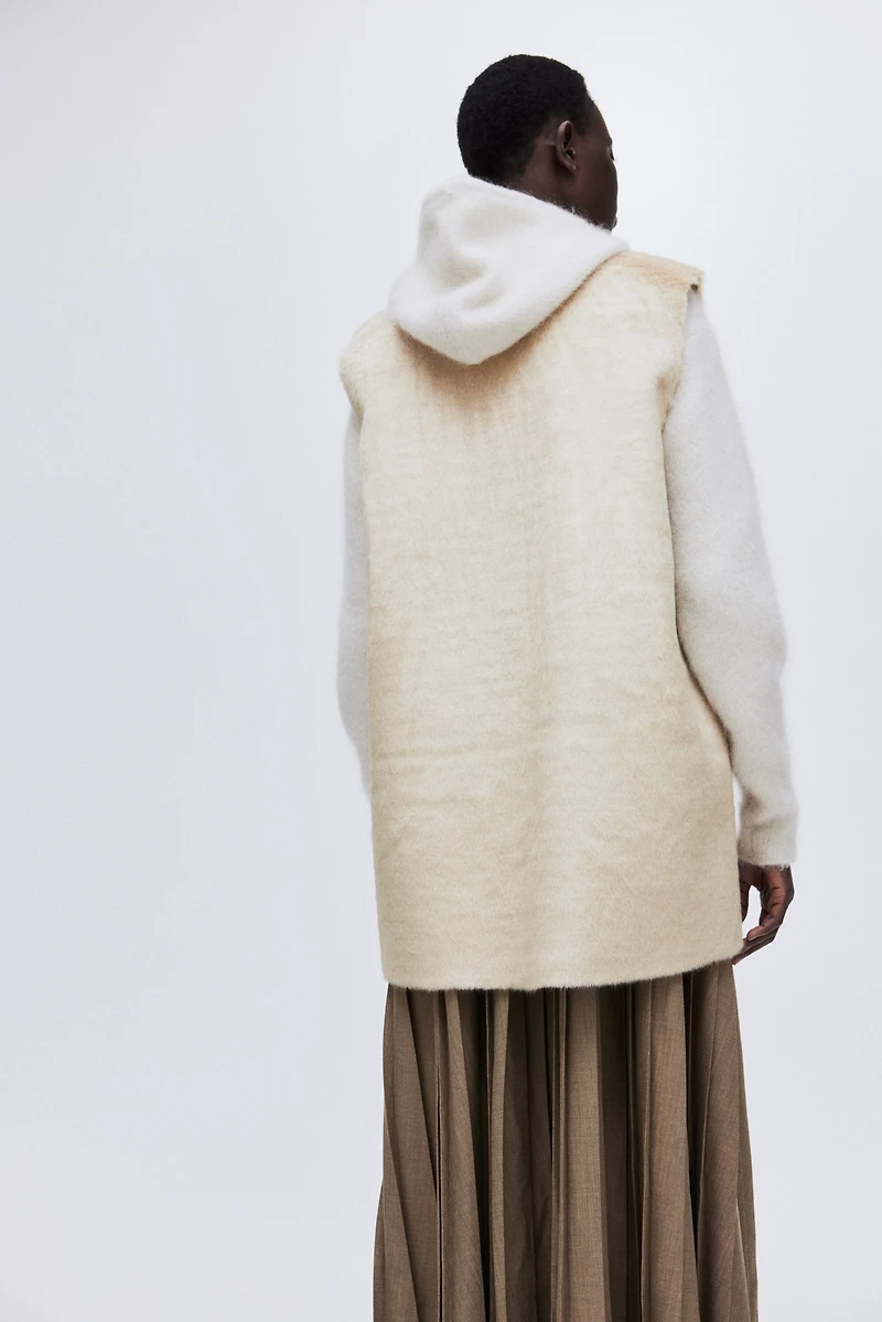 Longue veste sans manches