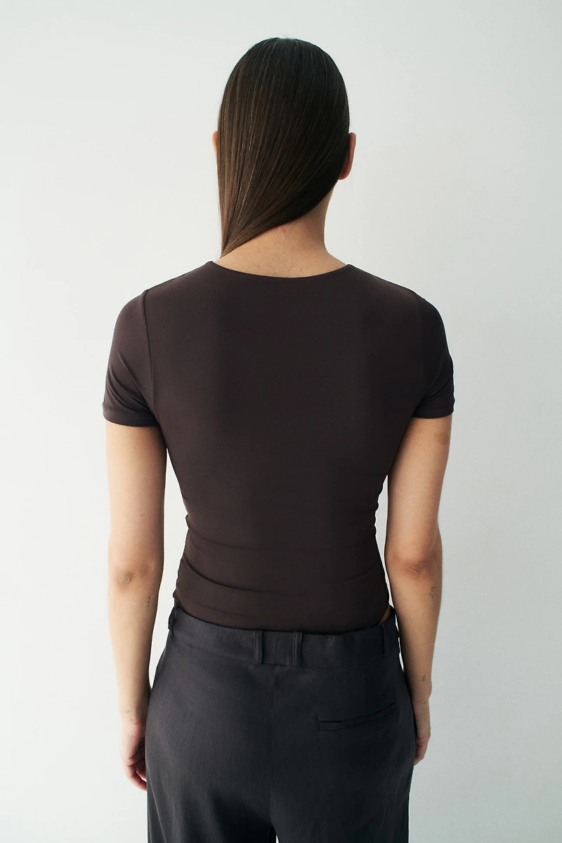 Maillot Tanga moulant à manches courtes