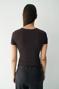 Maillot Tanga moulant à manches courtes