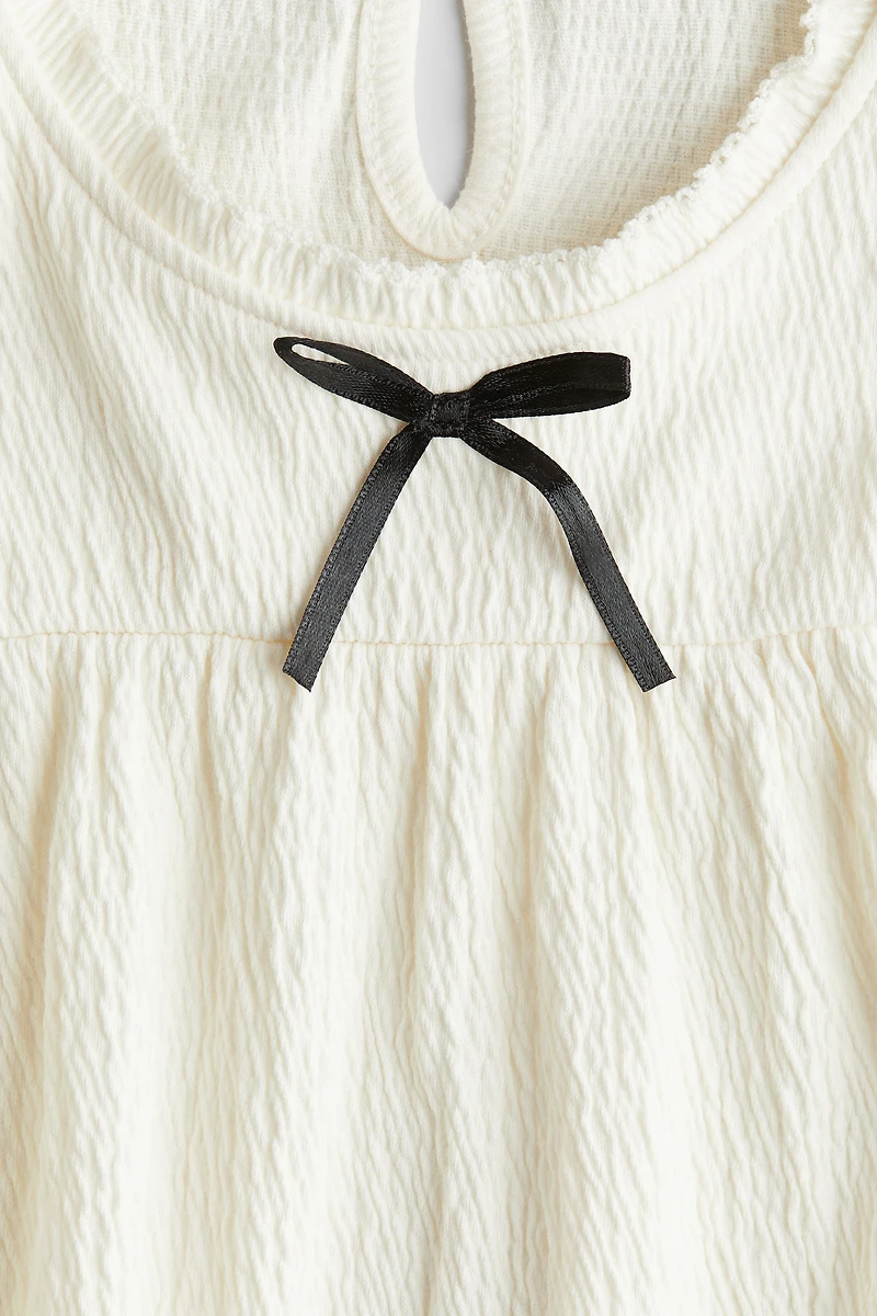 Blouse à bords picots