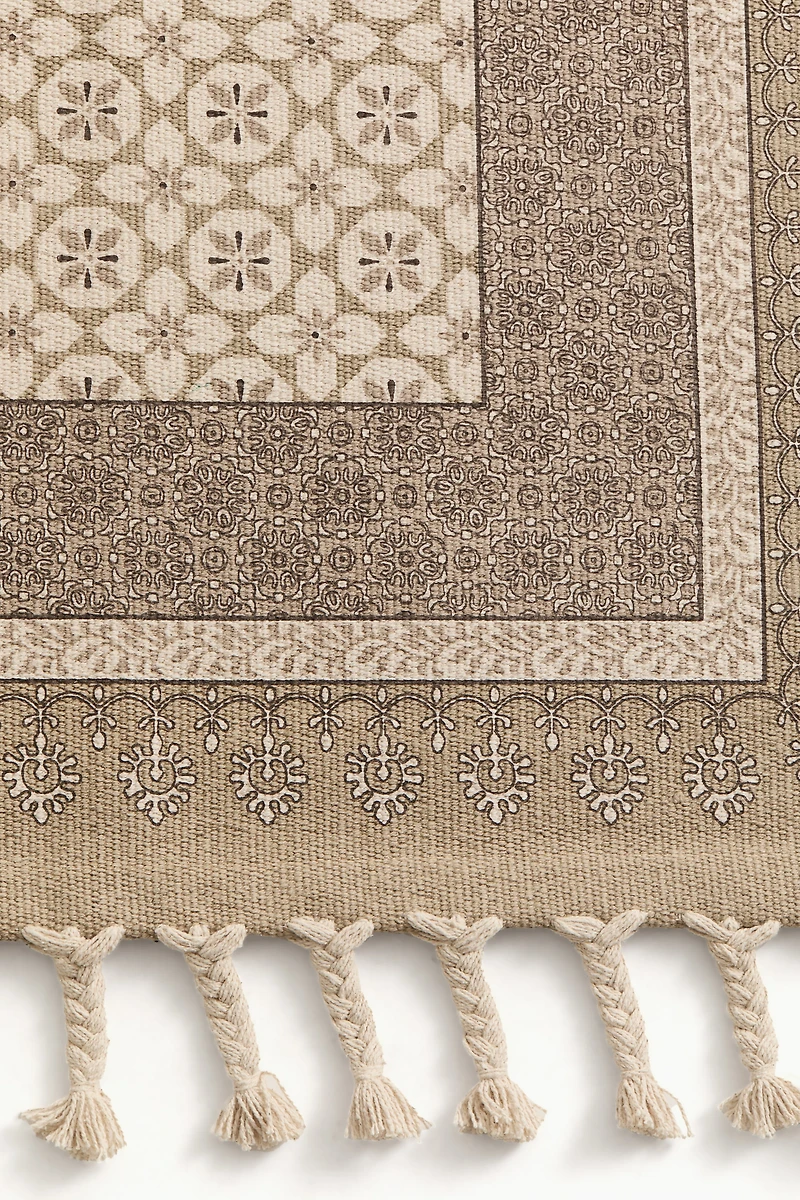 Tapis à motif avec franges