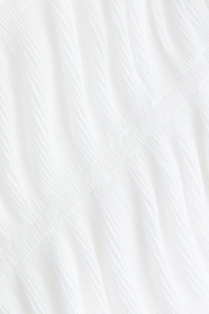 Haut nid d'abeille à encolure bateau