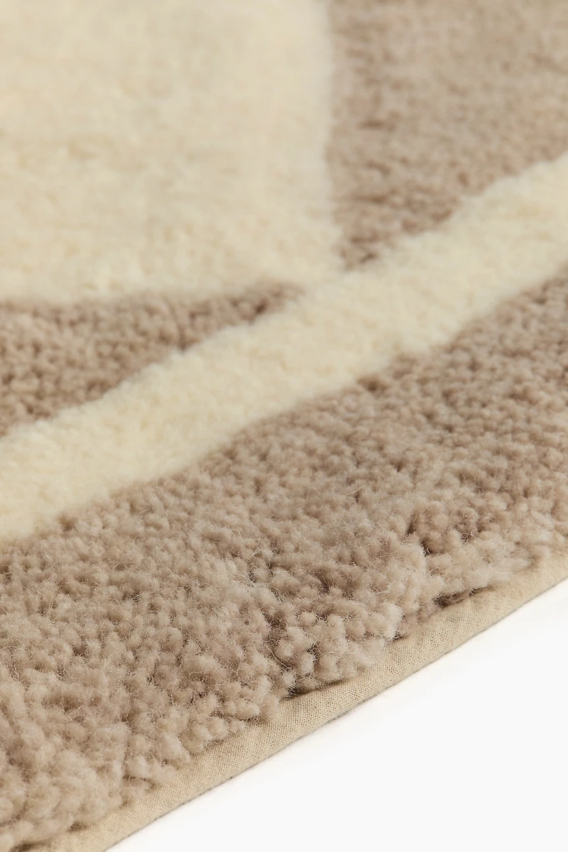 Tapis à motif arlequin en laine mélangée