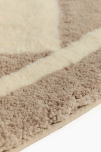 Tapis à motif arlequin en laine mélangée