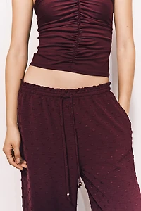 Pantalon en plumetis avec cordon de serrage