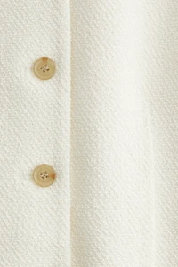 Longue robe à boutons en bouclé