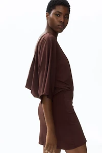 Cape-Sleeved Low-Back Dress
