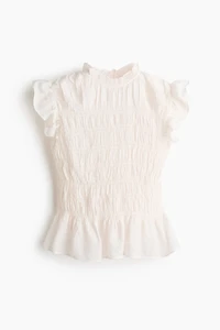 Haut péplum smocké