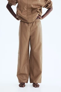 Pantalon en tissu enduit