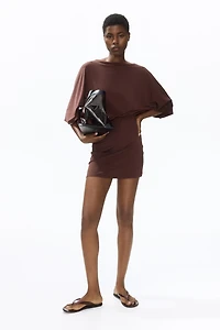 Cape-Sleeved Low-Back Dress