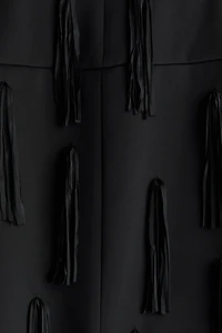 Veste frangée