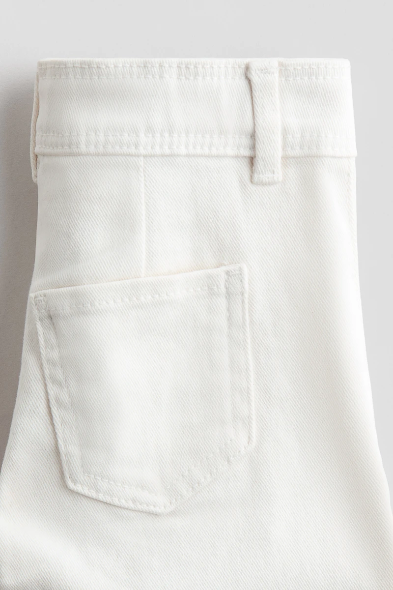 Pantalon évasé avec perles de fantaisie