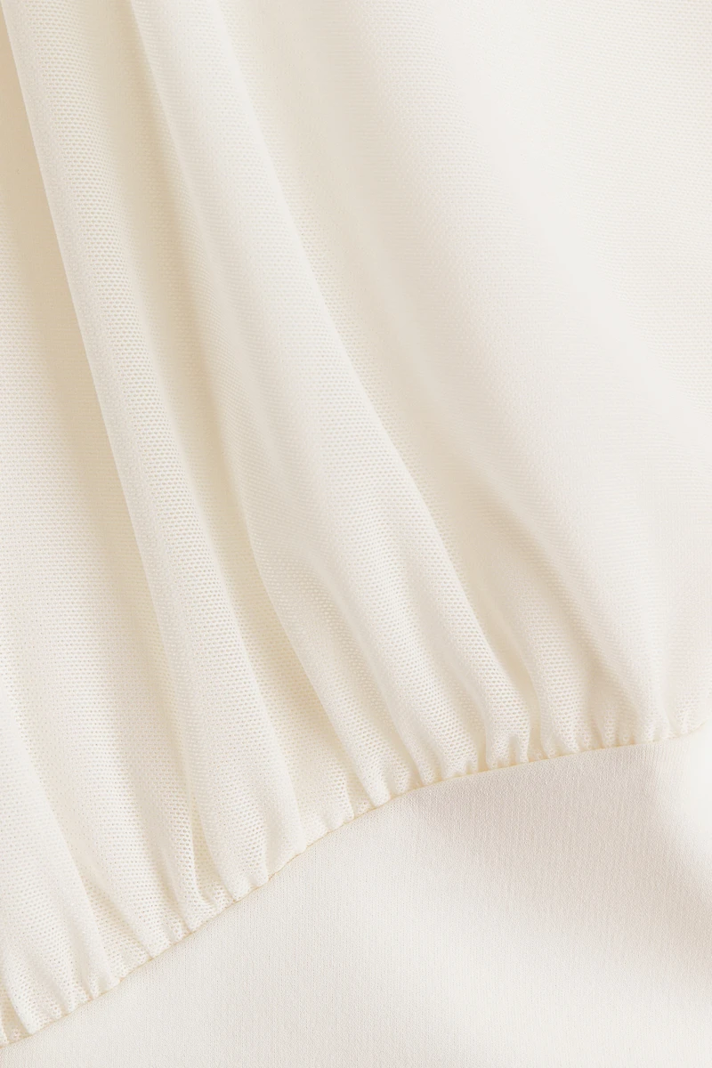 Haut sans manches à effet drapé