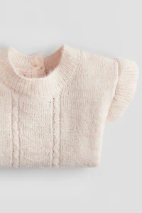 Chandail volanté à l'épaule