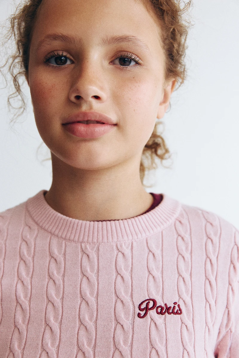 Haut en tricot torsadé