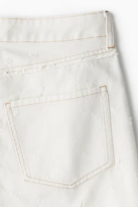 Pantalon en sergé à bords frangés