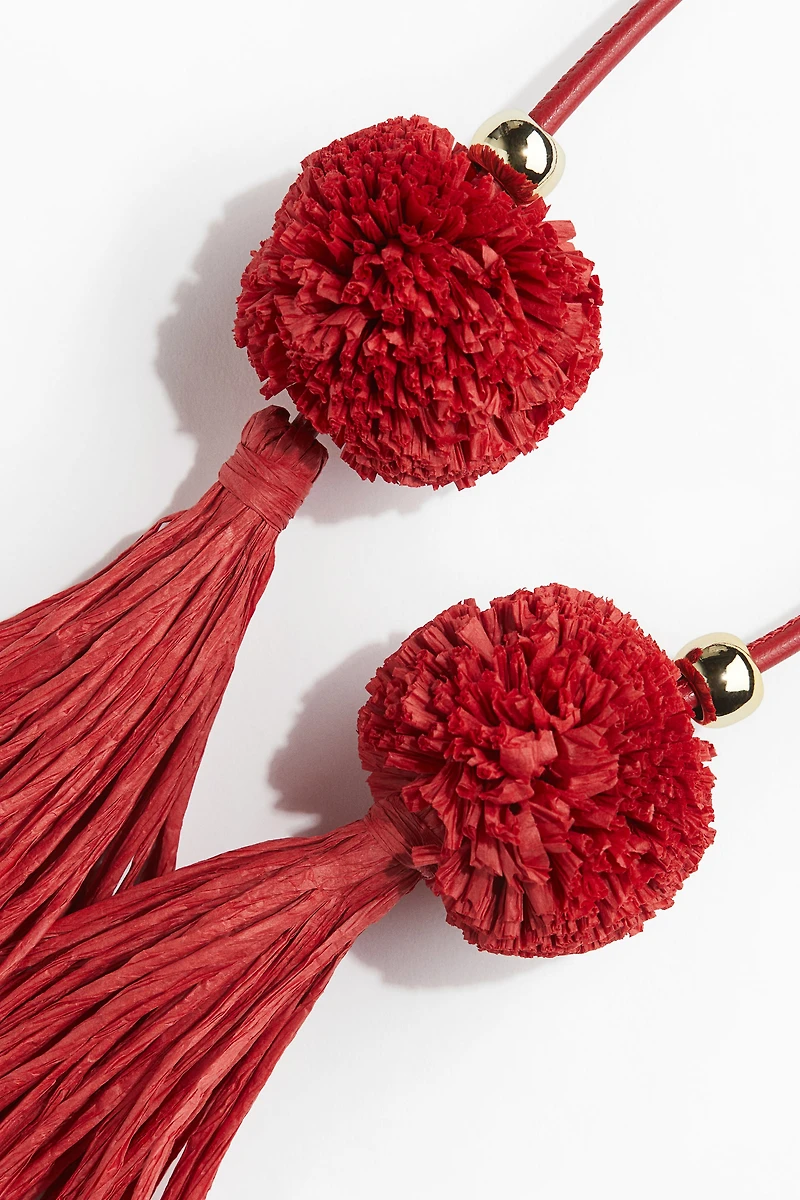 Décoration de sac avec gland en paille